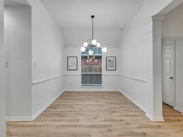 a view of a room with windows and entryway