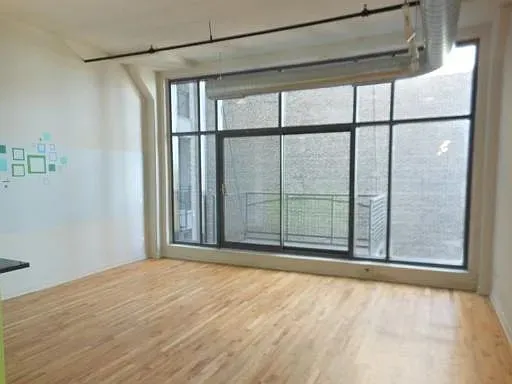 a view of a room with a large window