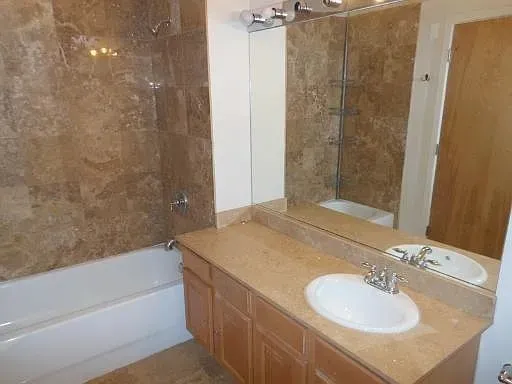 a bathroom with a sink and mirror
