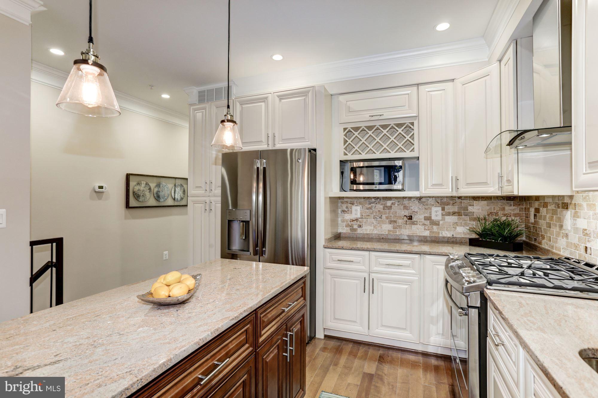 59 R Street Northeast, Unit 1 Washington, DC 20002 - Photo 12 of 40 a kitchen with refrigerator and stove