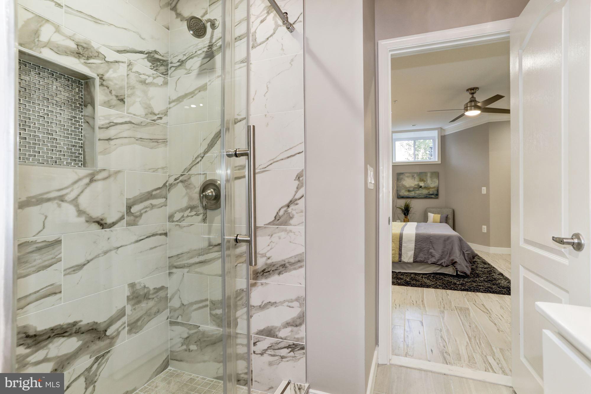 59 R Street Northeast, Unit 1 Washington, DC 20002 - Photo 30 of 40 a bathroom with a sink and shower