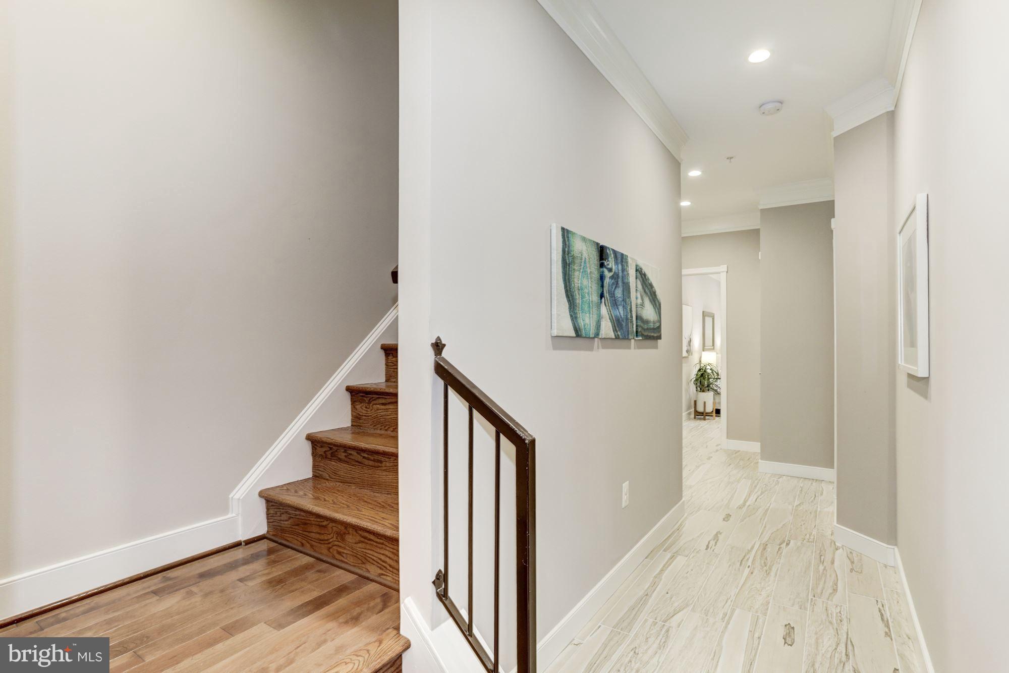 59 R Street Northeast, Unit 1 Washington, DC 20002 - Photo 31 of 40 a view of a hallway with wooden floor and entryway