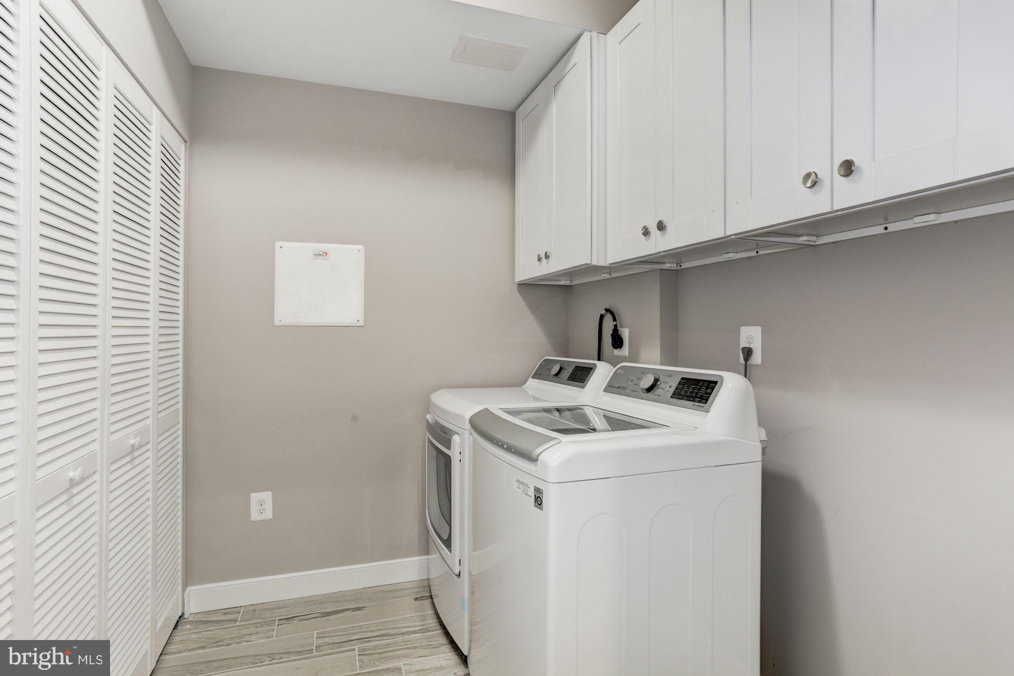 59 R Street Northeast, Unit 1 Washington, DC 20002 - Photo 33 of 40 a utility room with dryer and washer