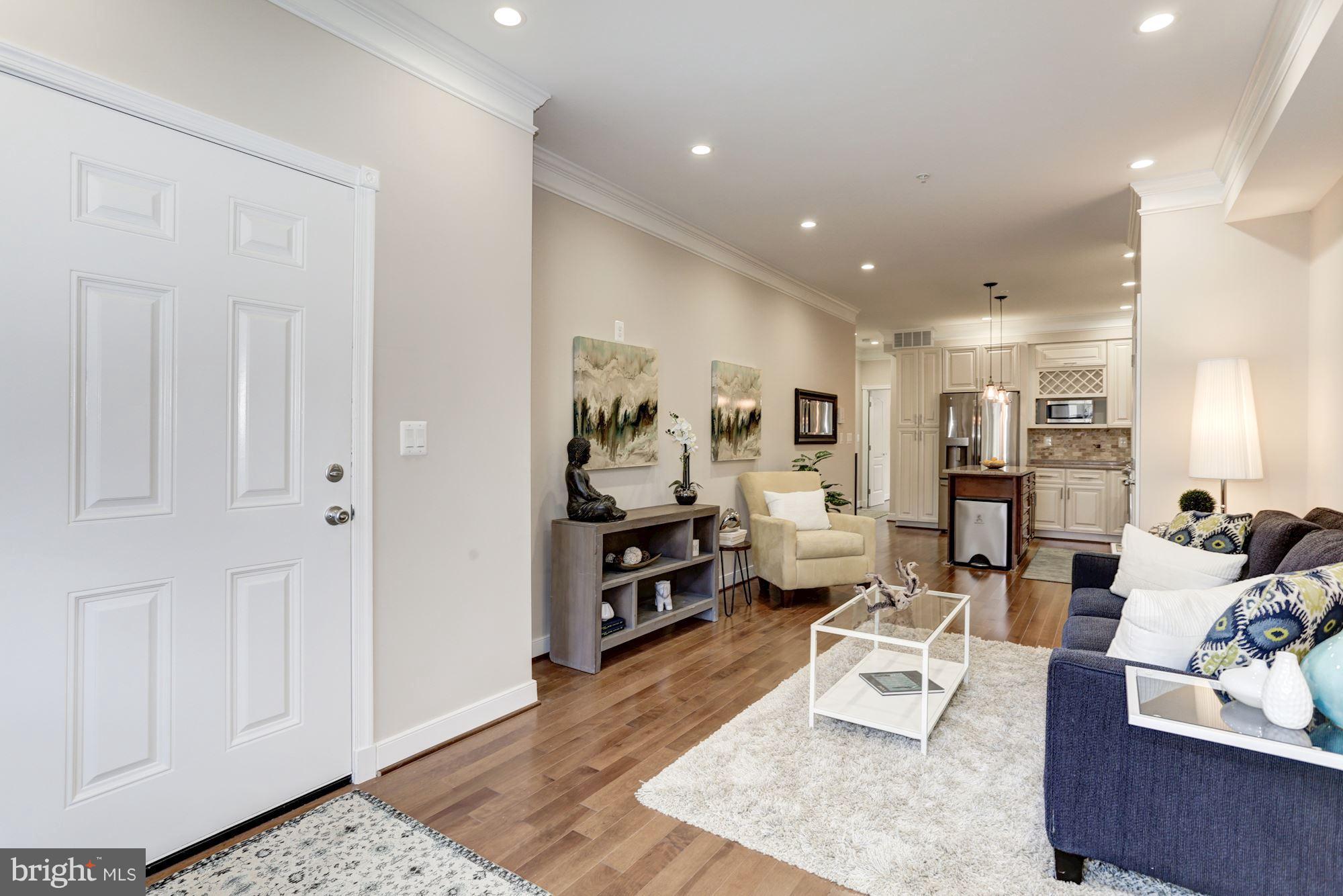 59 R Street Northeast, Unit 1 Washington, DC 20002 - Photo 6 of 40 a living room with furniture and a wooden floor