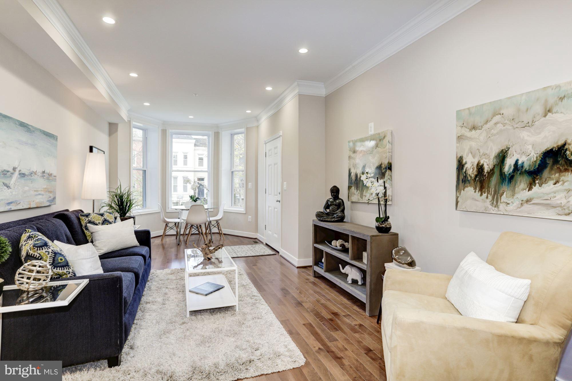 59 R Street Northeast, Unit 1 Washington, DC 20002 - Photo 9 of 40 a living room with furniture and a couch
