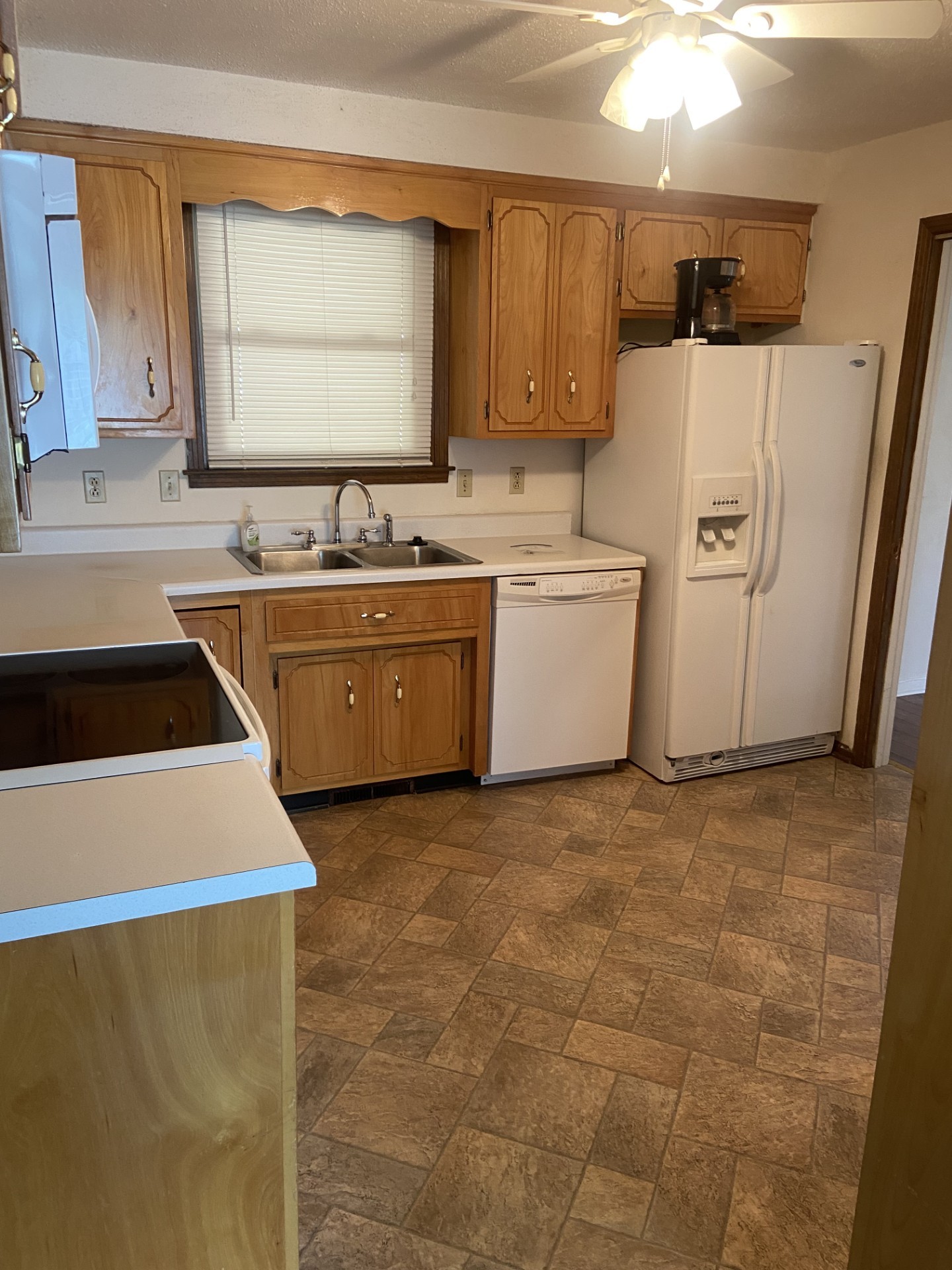 2169 Post Road Clarksville, TN 37043 - Photo 2 of 14 a kitchen with a sink a stove top oven and white stainless steel appliances