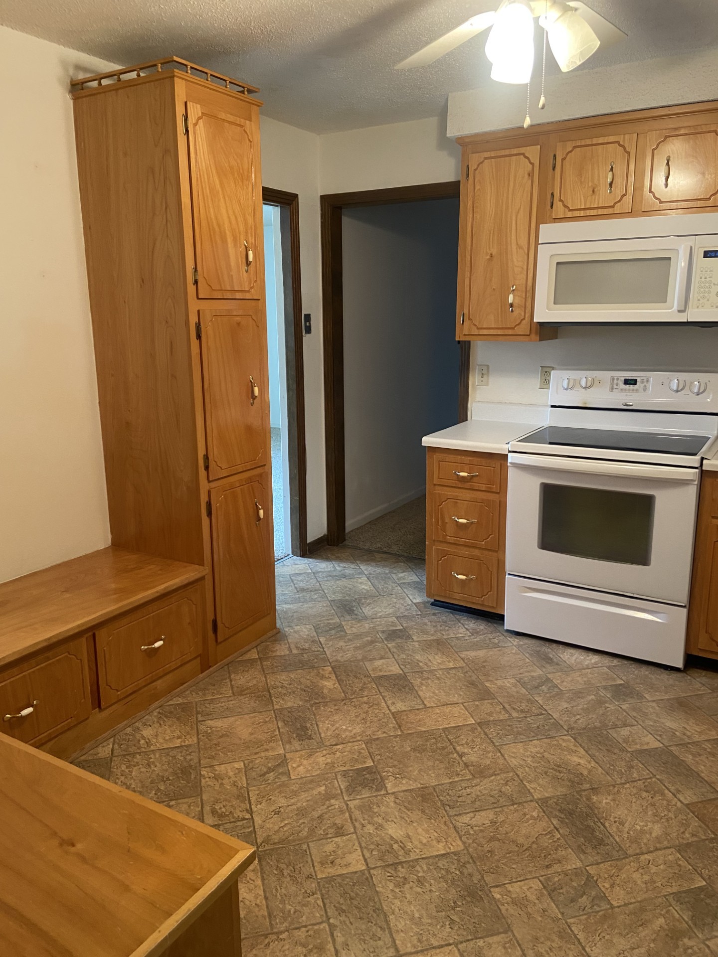 2169 Post Road Clarksville, TN 37043 - Photo 3 of 14 a kitchen with granite countertop a stove top oven and cabinets