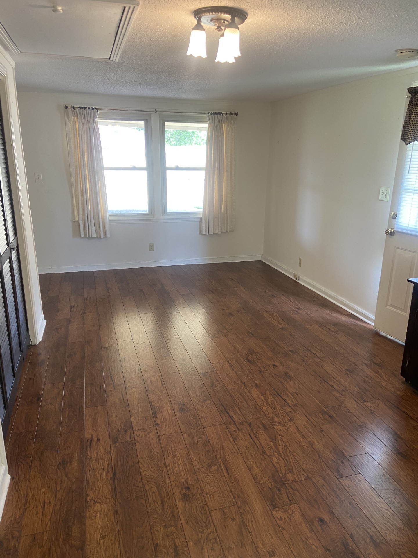 2169 Post Road Clarksville, TN 37043 - Photo 7 of 14 an empty room with wooden floor and windows