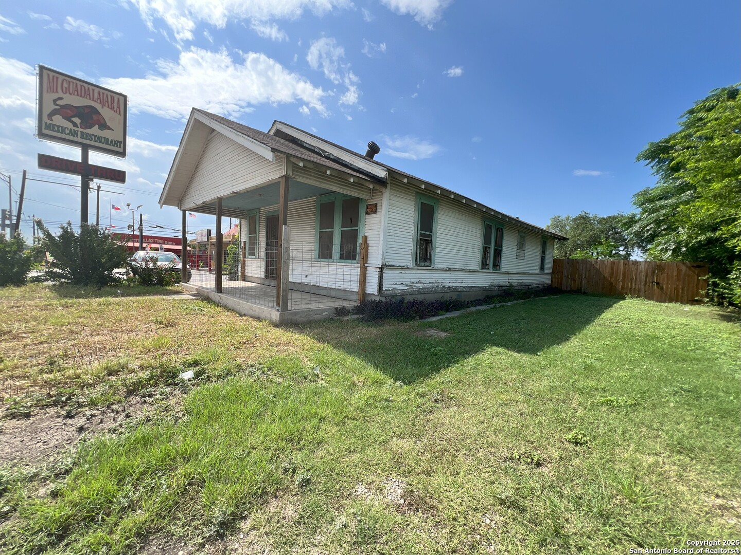 1143 Culebra Road San Antonio, TX 78201 - Photo 5 of 6 a front view of a house with a yard