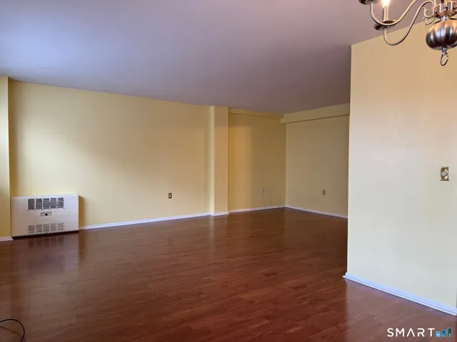 a view of room and hardwood floor