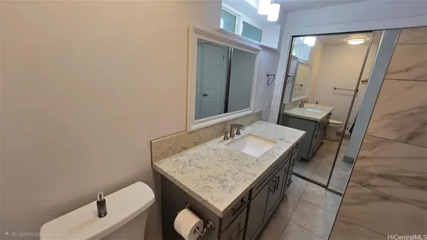 a bathroom with a granite countertop sink and a mirror