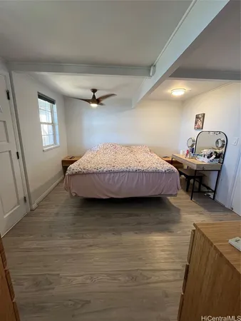 a bedroom with a bed and window