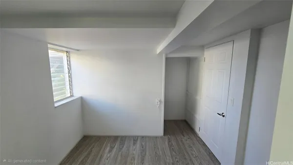 a view of hallway with window and wooden floor