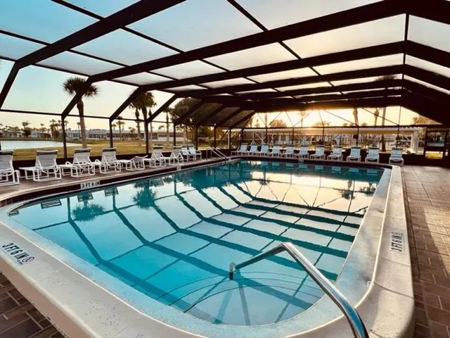 a view of a swimming pool with a patio