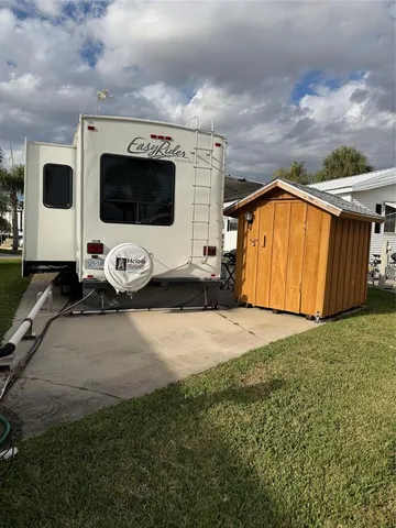 a view of a backyard of the house