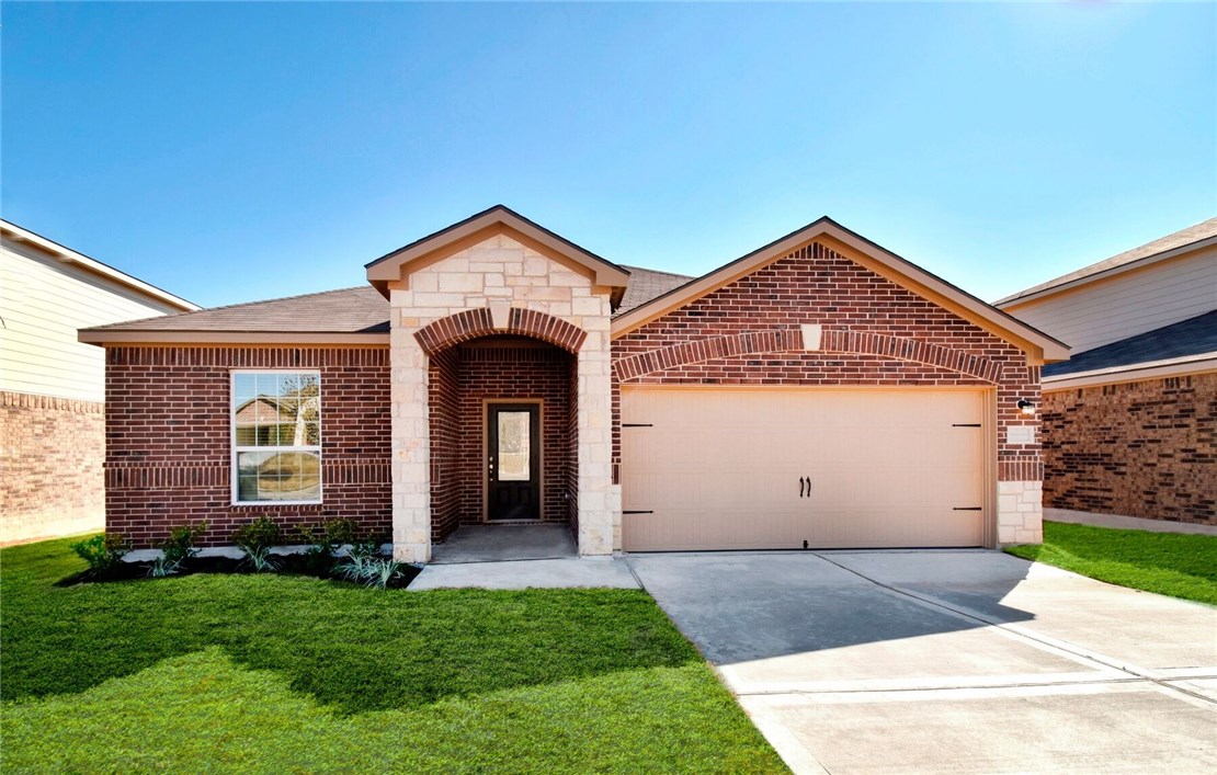 20009 Hubert R Humphrey Road Manor, TX 78653 - Photo 1 of 1 a front view of a house with a yard and garage