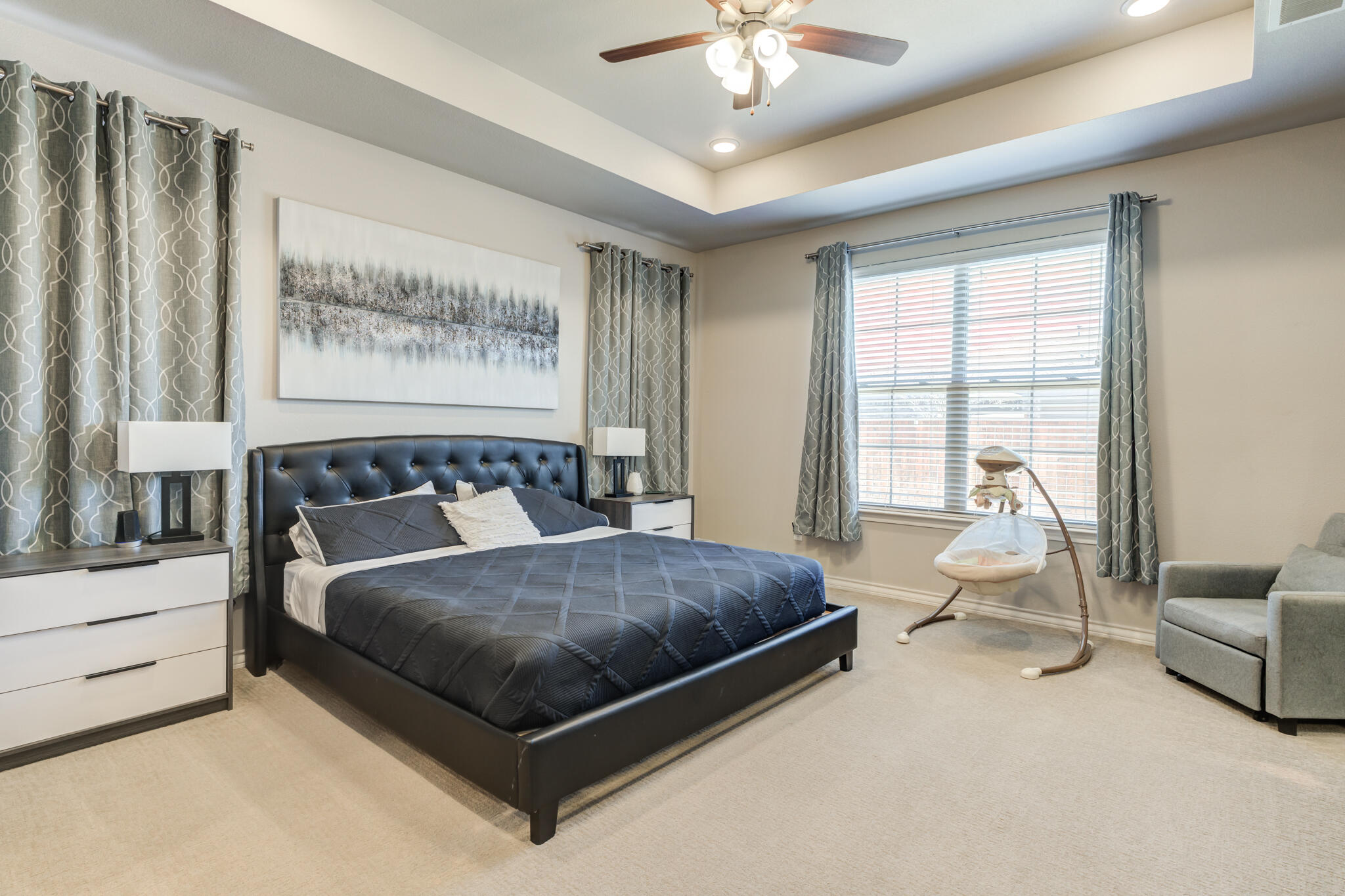 9609 Inverness Avenue Lubbock, TX 79424 - Photo 12 of 17 a bedroom with a bed couch and window