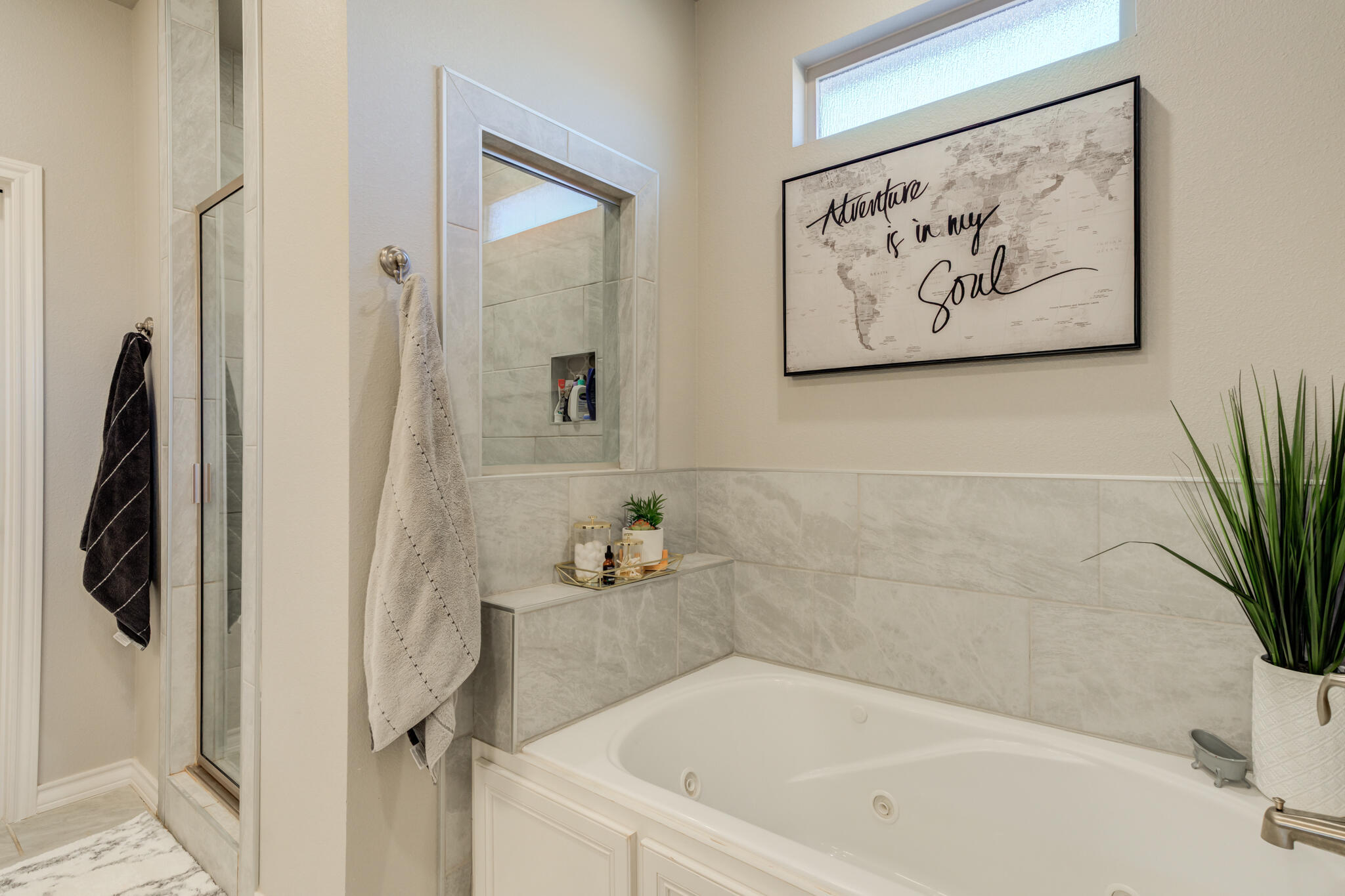 9609 Inverness Avenue Lubbock, TX 79424 - Photo 14 of 17 a white bath tub sitting next to a white wall