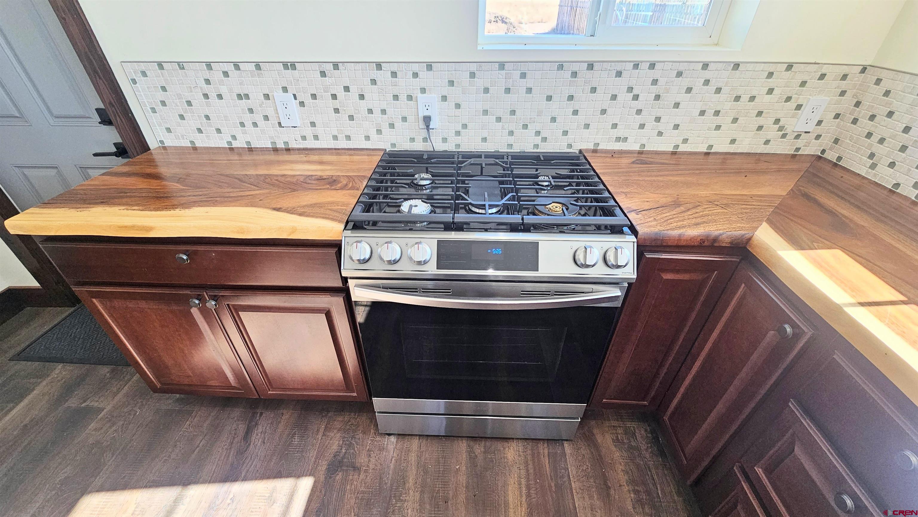 10547 Palm Road Blanca, CO 81123 - Photo 17 of 32 a stove top oven sitting inside of a kitchen