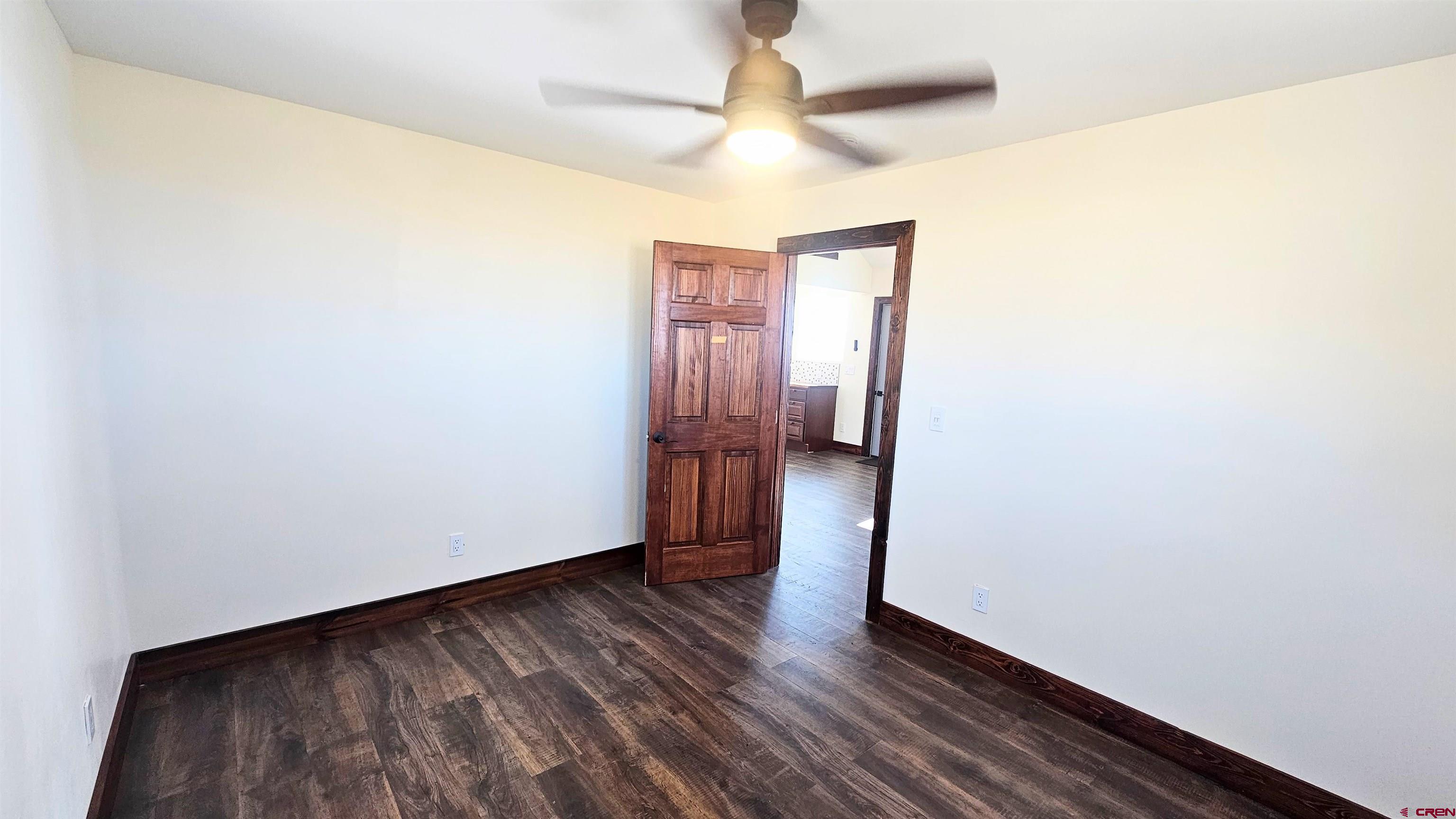 10547 Palm Road Blanca, CO 81123 - Photo 20 of 32 a view of an empty room with wooden floor