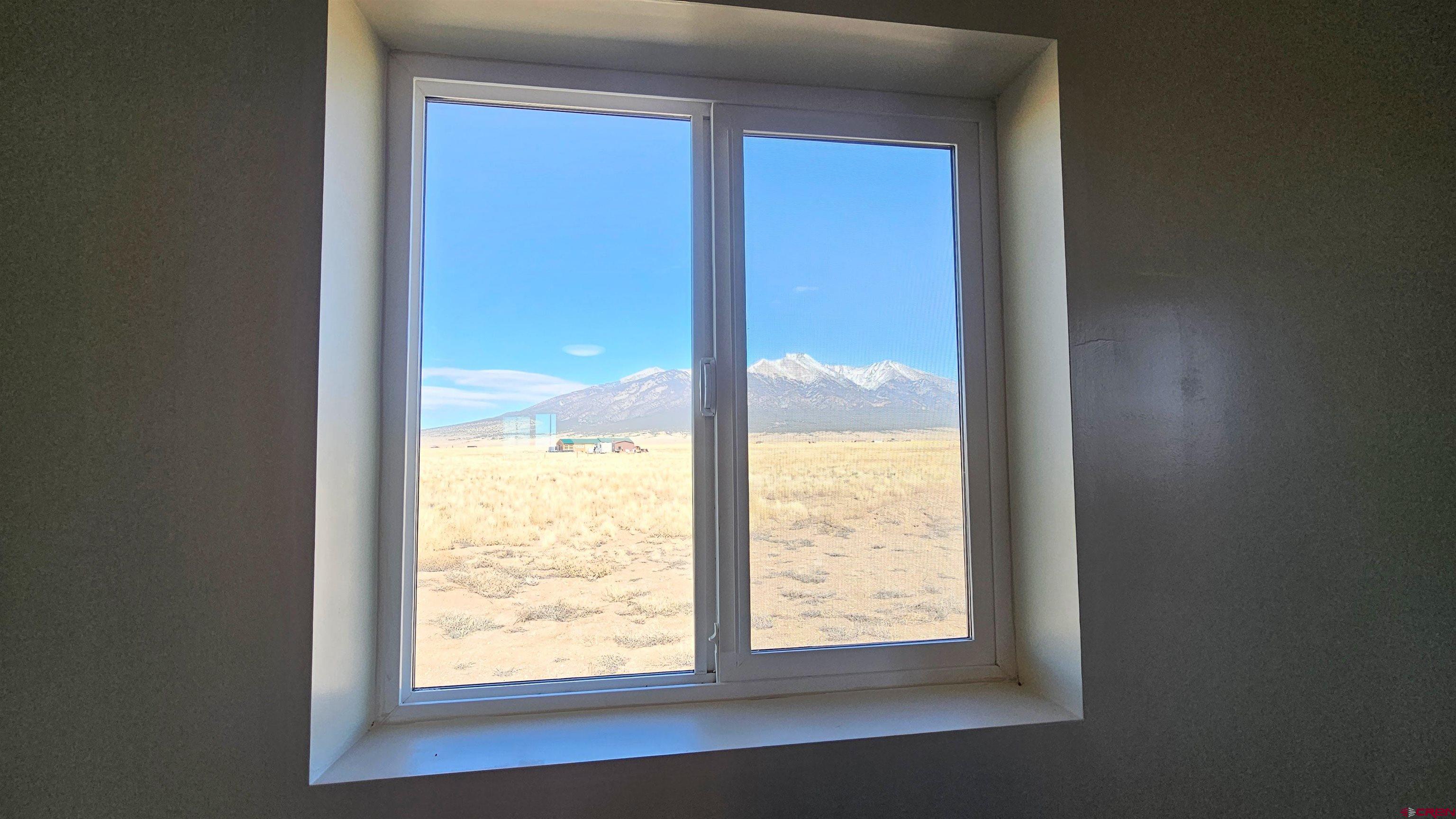 10547 Palm Road Blanca, CO 81123 - Photo 22 of 32 a view of an empty room and window