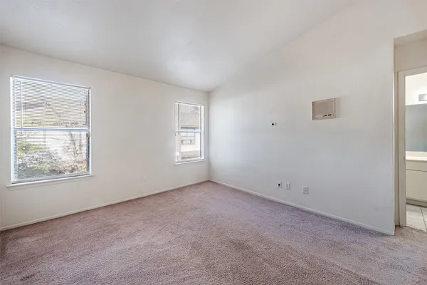 a bathroom with a toilet and bathtub