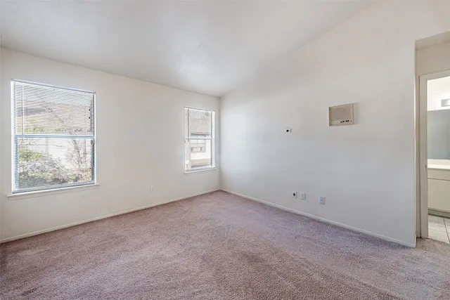 a bathroom with a toilet and bathtub