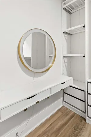 a view of a livingroom with wooden floor