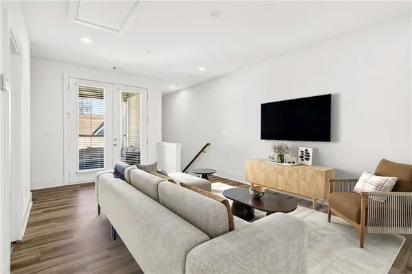 a view of empty room with wooden floor