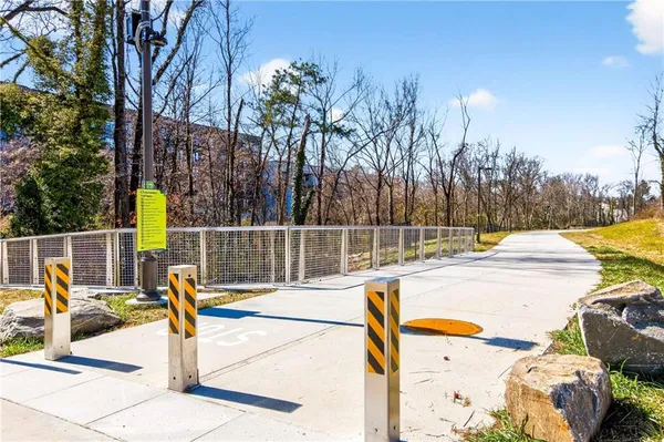 a view of a swimming pool with an outdoor seating and a yard