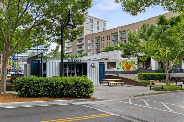 a view of a cafe with sitting area
