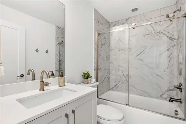 a living room with furniture a window and a chandelier