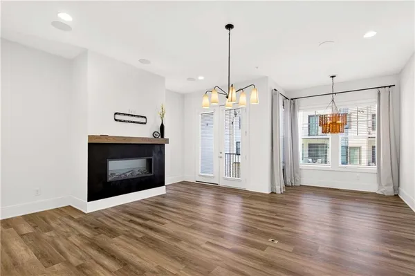 a kitchen with stainless steel appliances granite countertop a sink a stove and a microwave