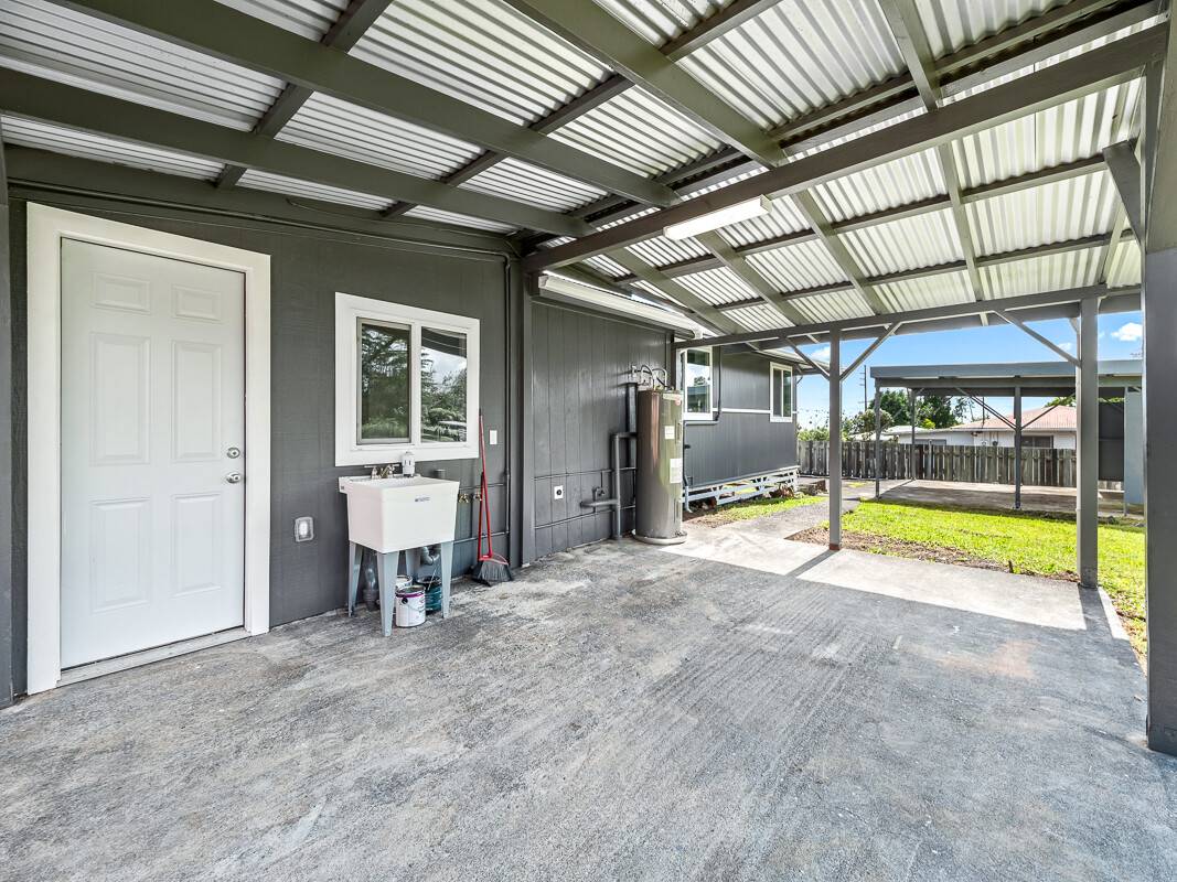 1907 Uhaloa Road Hilo, HI 96720 - Photo 18 of 23 an empty room with ceiling fan and windows