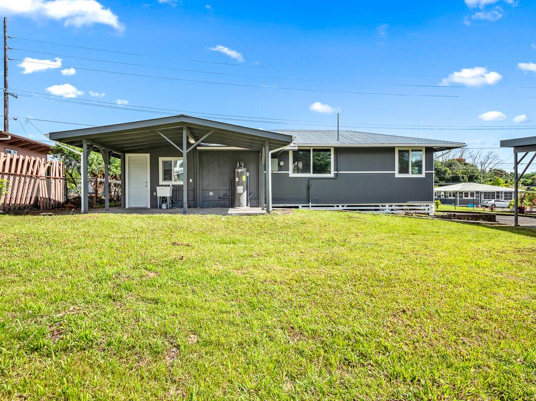 1907 Uhaloa Road Hilo, HI 96720 - Photo 19 of 23 a view of a house with a yard