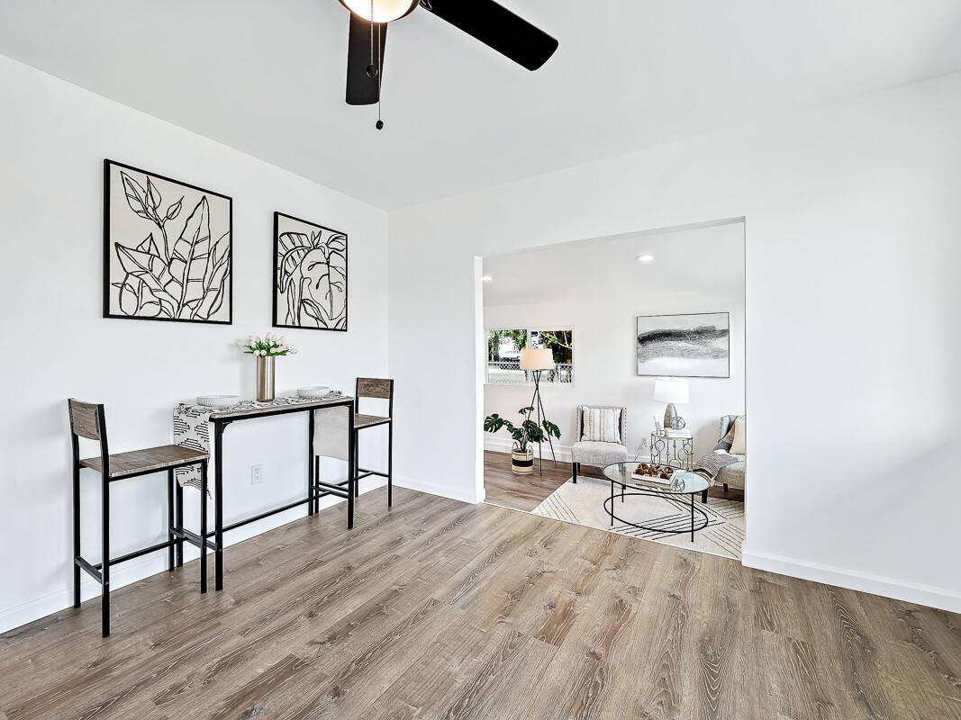 1907 Uhaloa Road Hilo, HI 96720 - Photo 2 of 23 a living room with furniture and a wooden floor