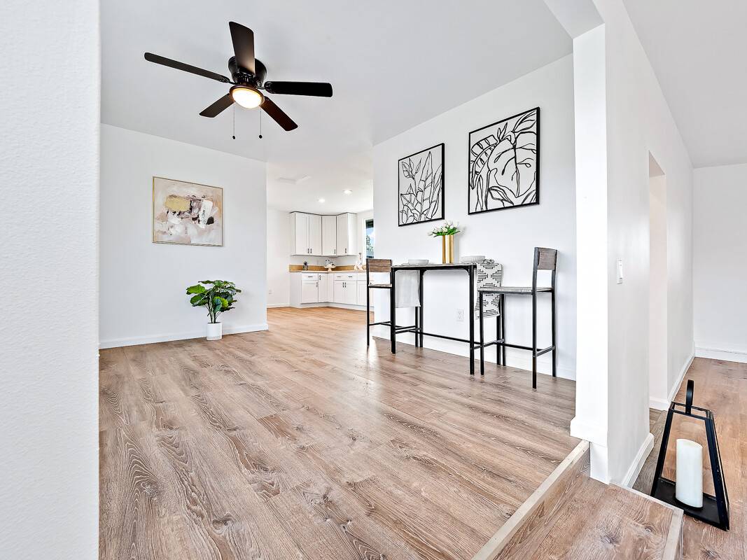 1907 Uhaloa Road Hilo, HI 96720 - Photo 3 of 23 a living room with furniture and a wooden floor