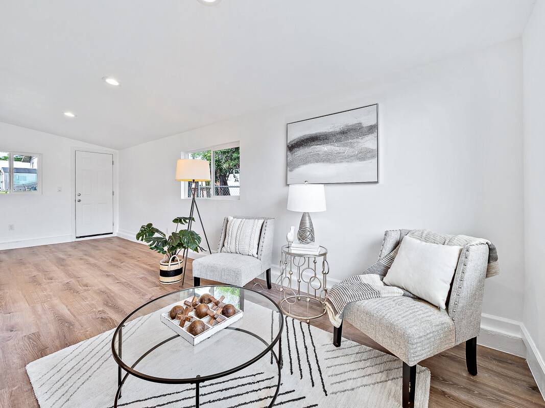 1907 Uhaloa Road Hilo, HI 96720 - Photo 4 of 23 a living room with furniture and wooden floor