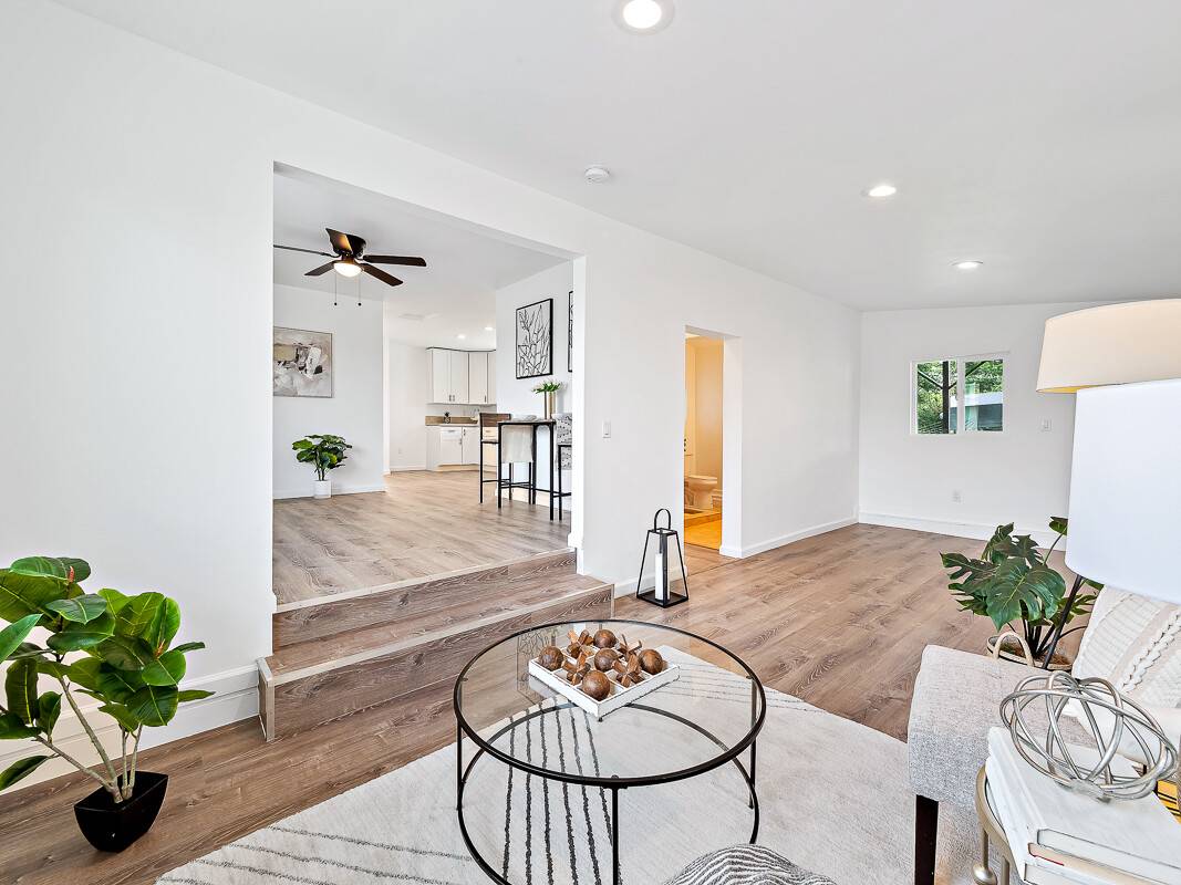 1907 Uhaloa Road Hilo, HI 96720 - Photo 5 of 23 a living room with furniture and a table