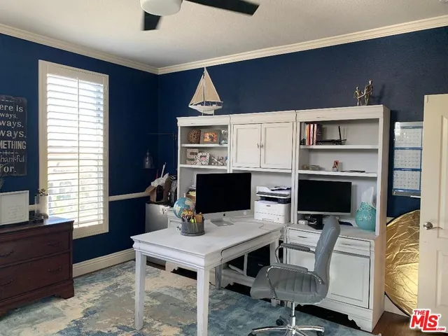 a workspace with furniture and window