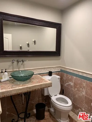 a bathroom with a toilet and a sink