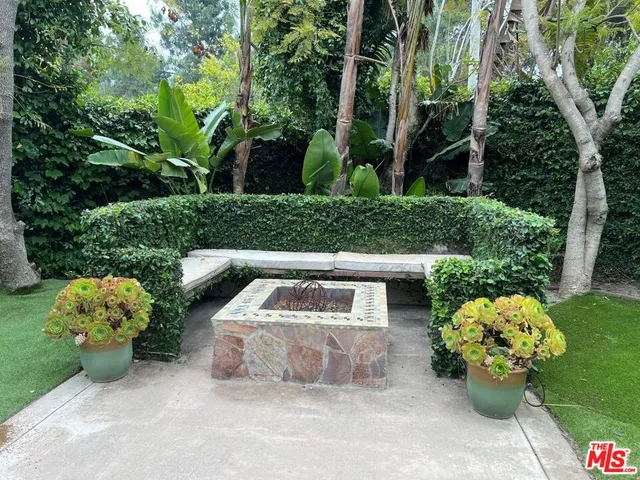 a backyard of a house with yard and outdoor seating