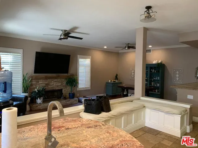 a living room with fireplace furniture and a flat screen tv