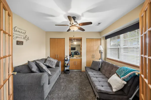 a living room with furniture and a large window