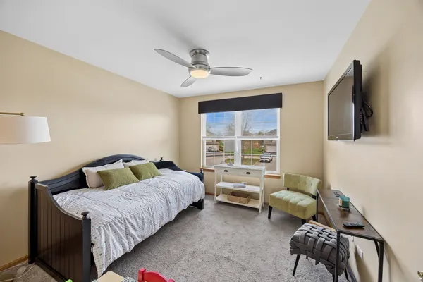 a bedroom with a bed and a couch
