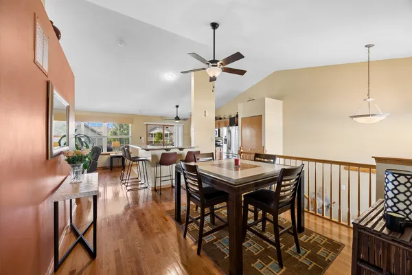 a view of a dining room with furniture window and wooden floor