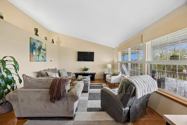 a living room with furniture and large window
