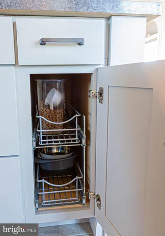 a stove top oven sitting inside of a kitchen