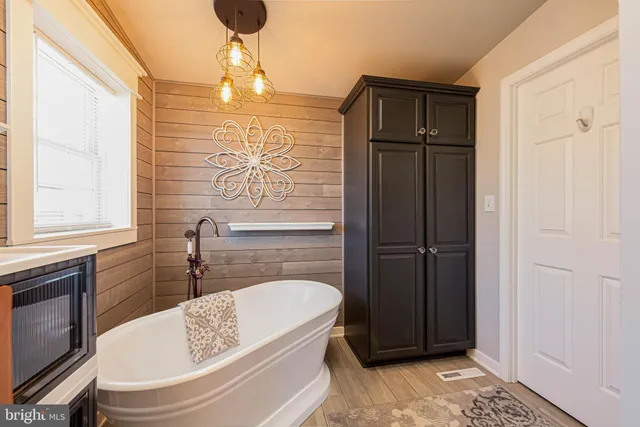 a bathroom with a sink a toilet and bathtub
