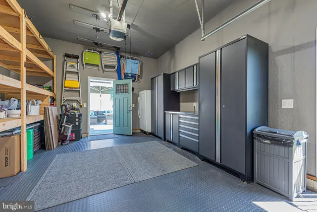 a view of a refrigerator storage and utility room